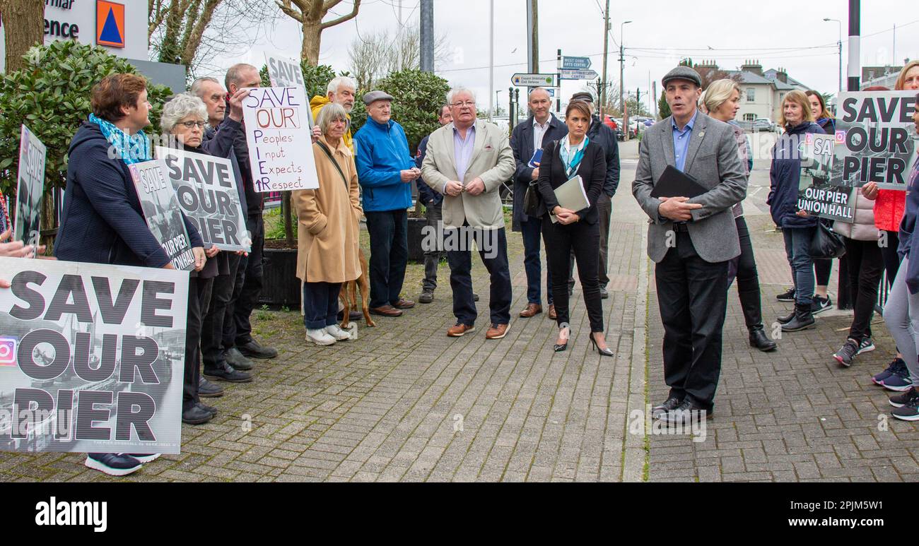 People demonstrating or protesting in Ireland with placards to save their pier. Stock Photo