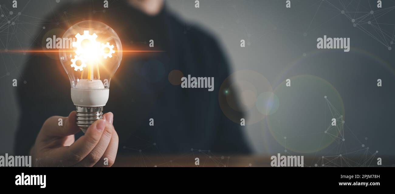 Innovation design concept. Hand holding light bulb for new idea brain ...