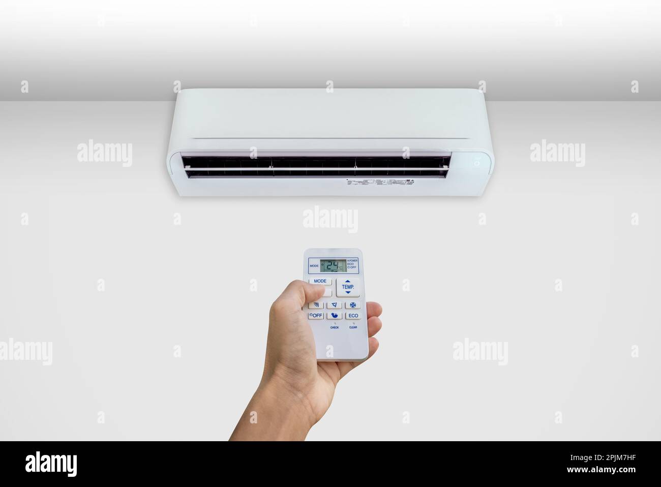 Man turning on the air conditioner Stock Photo Alamy