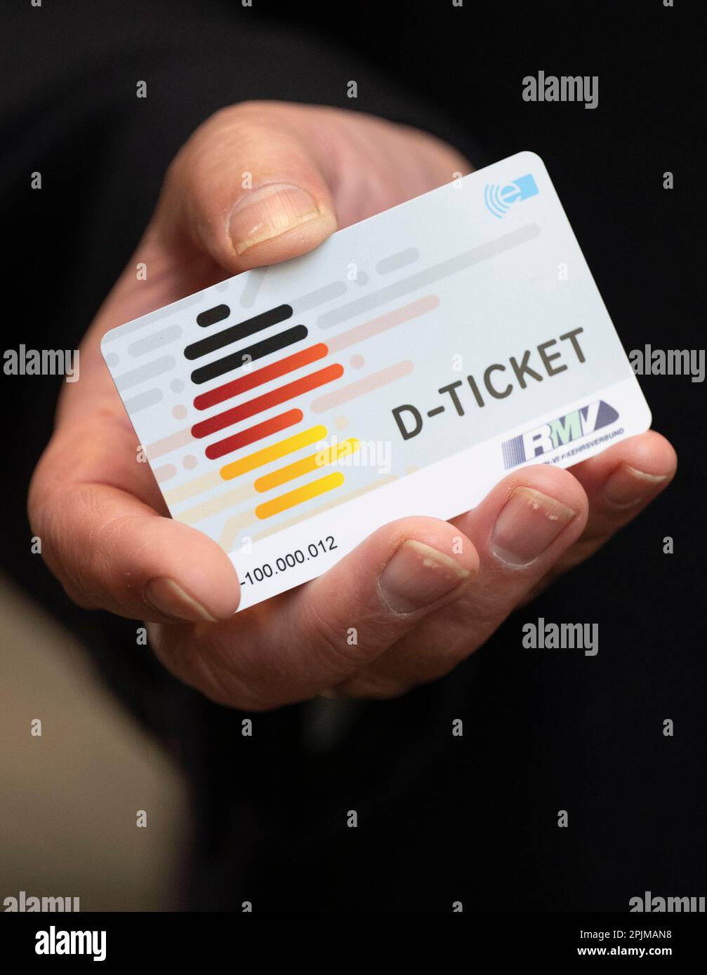 03 April 2023, Hesse, Frankfurt/Main: A "D-Ticket" in chip card format is  shown at a press event to mark the launch of sales of the Deutschlandticket  at Frankfurt Central Station. Photo: Boris
