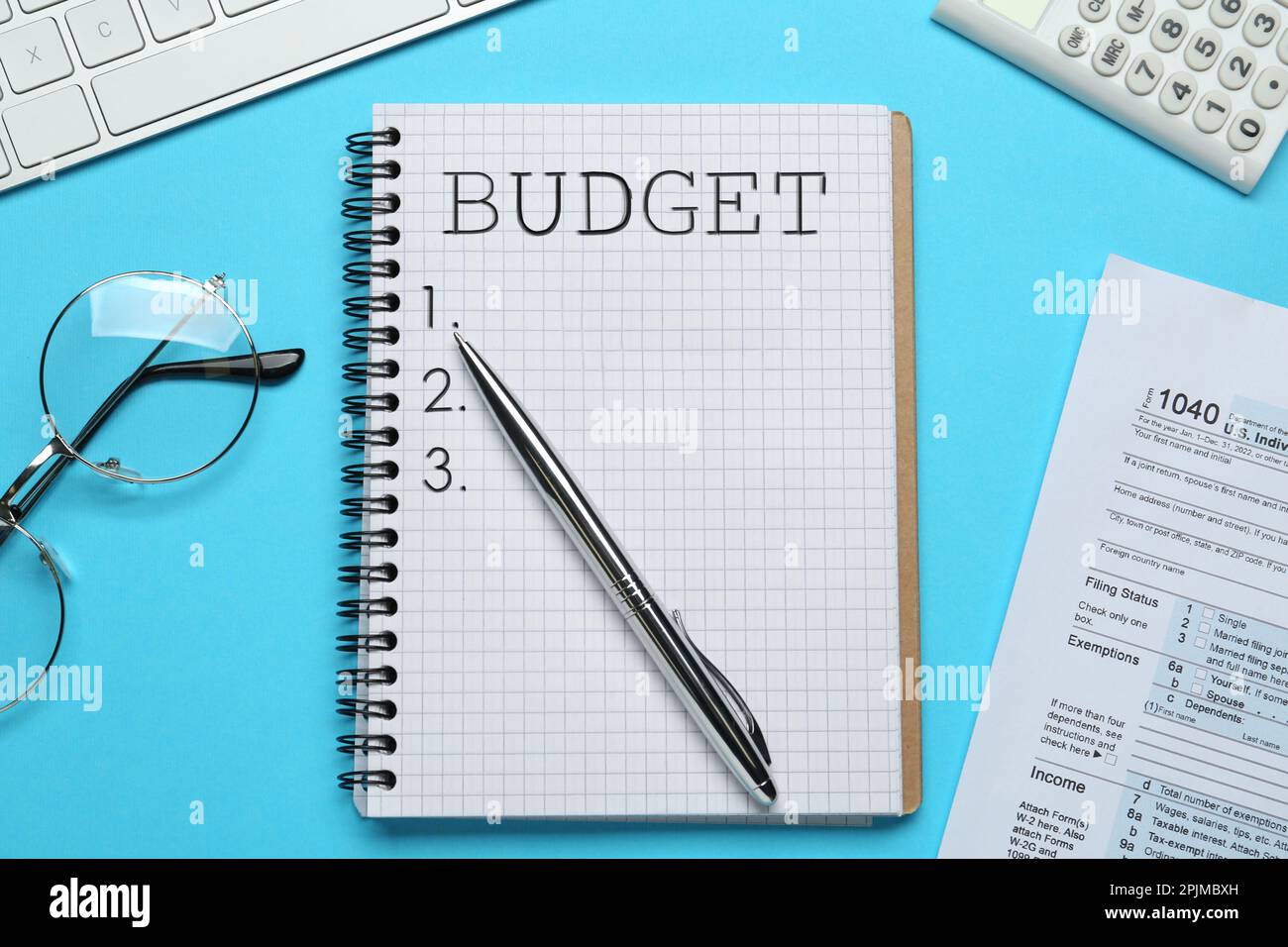 Notebook with words Budget, documents, computer keyboard, calculator ...