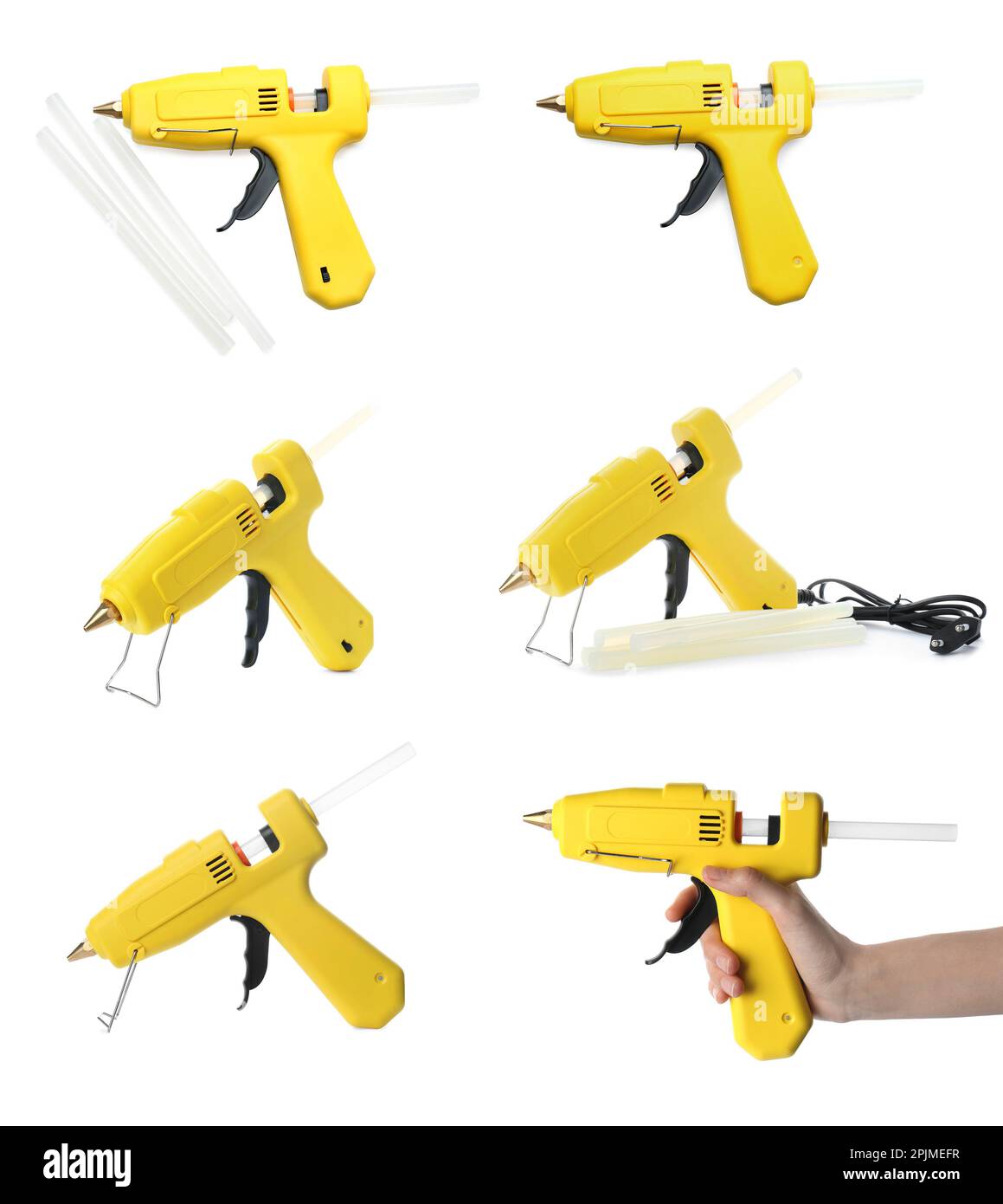 Set with yellow glue guns and sticks on white background Stock Photo