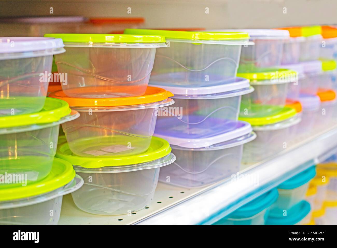 https://c8.alamy.com/comp/2PJMGW7/transparent-plastic-containers-with-colorful-lids-on-the-store-counter-horizontal-2PJMGW7.jpg