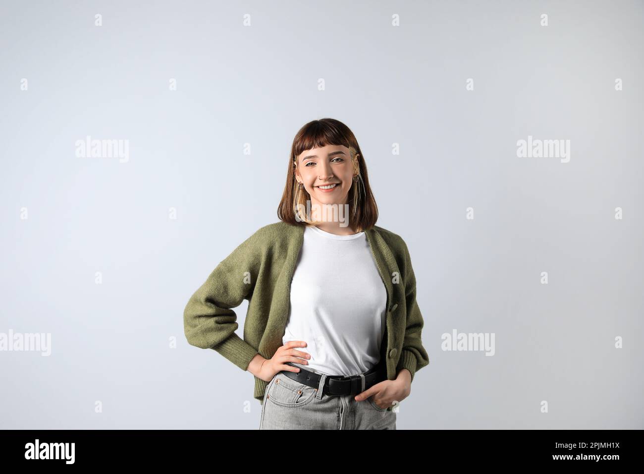 Beautiful young girl smiling on white background Stock Photo - Alamy