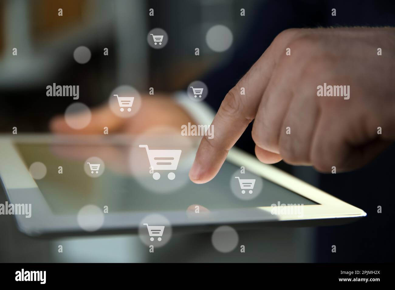 Delivery concept. Man using modern tablet for online shopping indoors ...