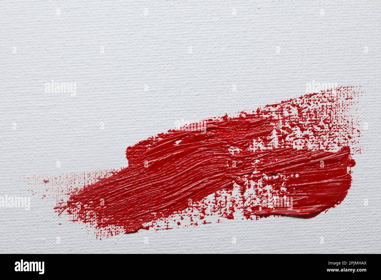 Stroke of red paint on white canvas, top view. Space for text Stock Photo Alamy
