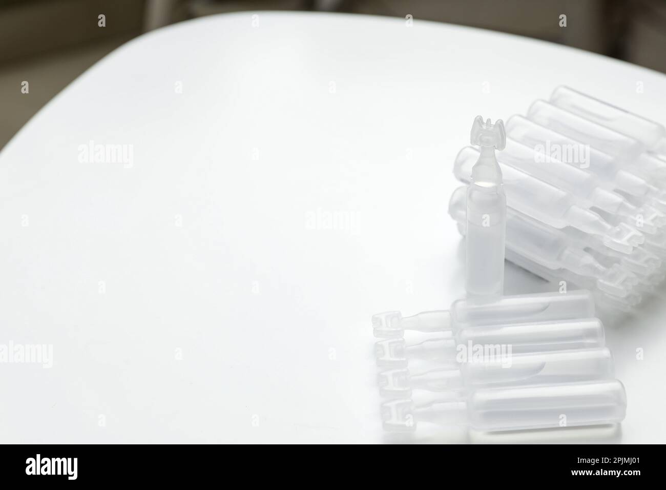 Single dose ampoules of sterile isotonic sea water solution on white