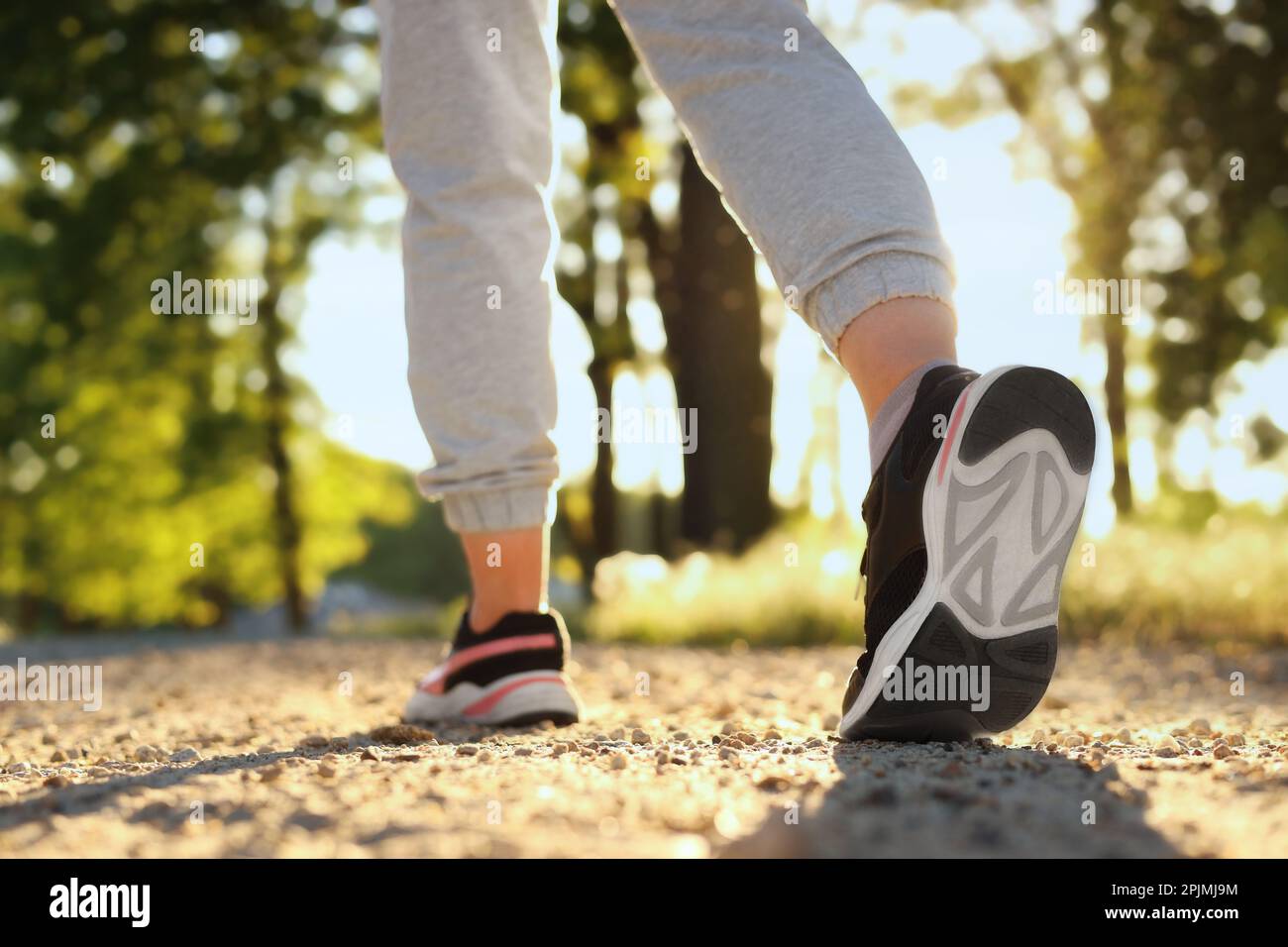 Woman jogging on pathway hi-res stock photography and images - Alamy