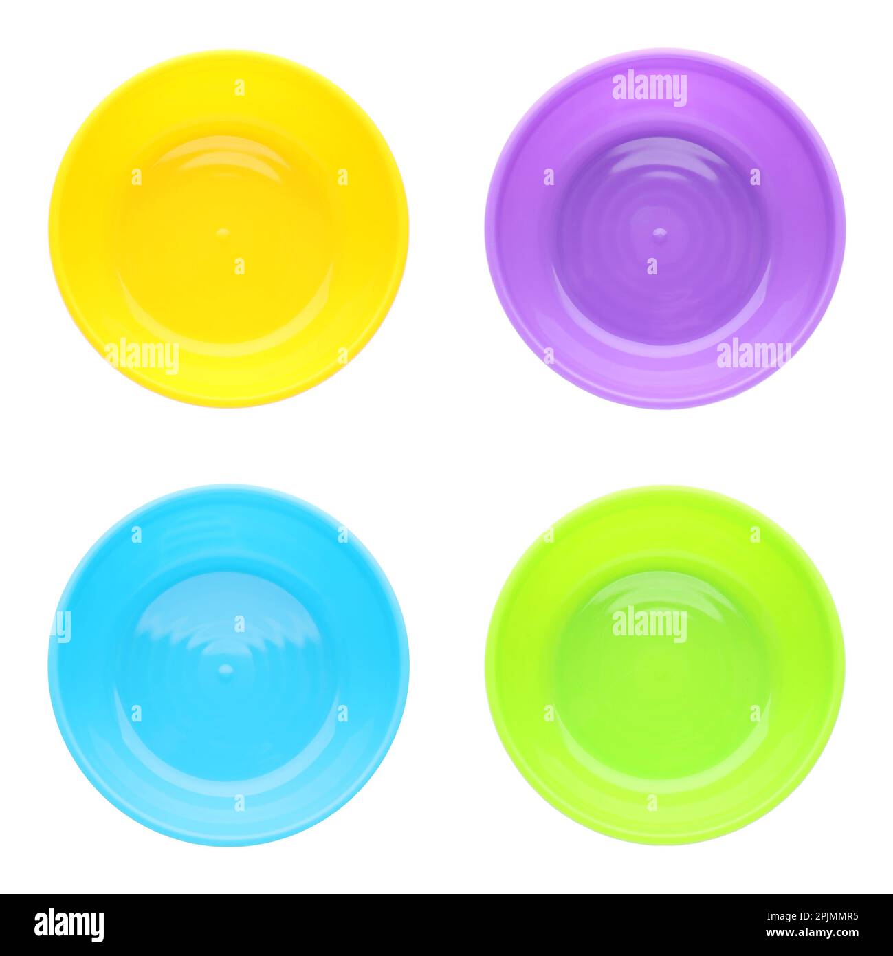 Set with colorful plastic plates on white background, top view. Serving