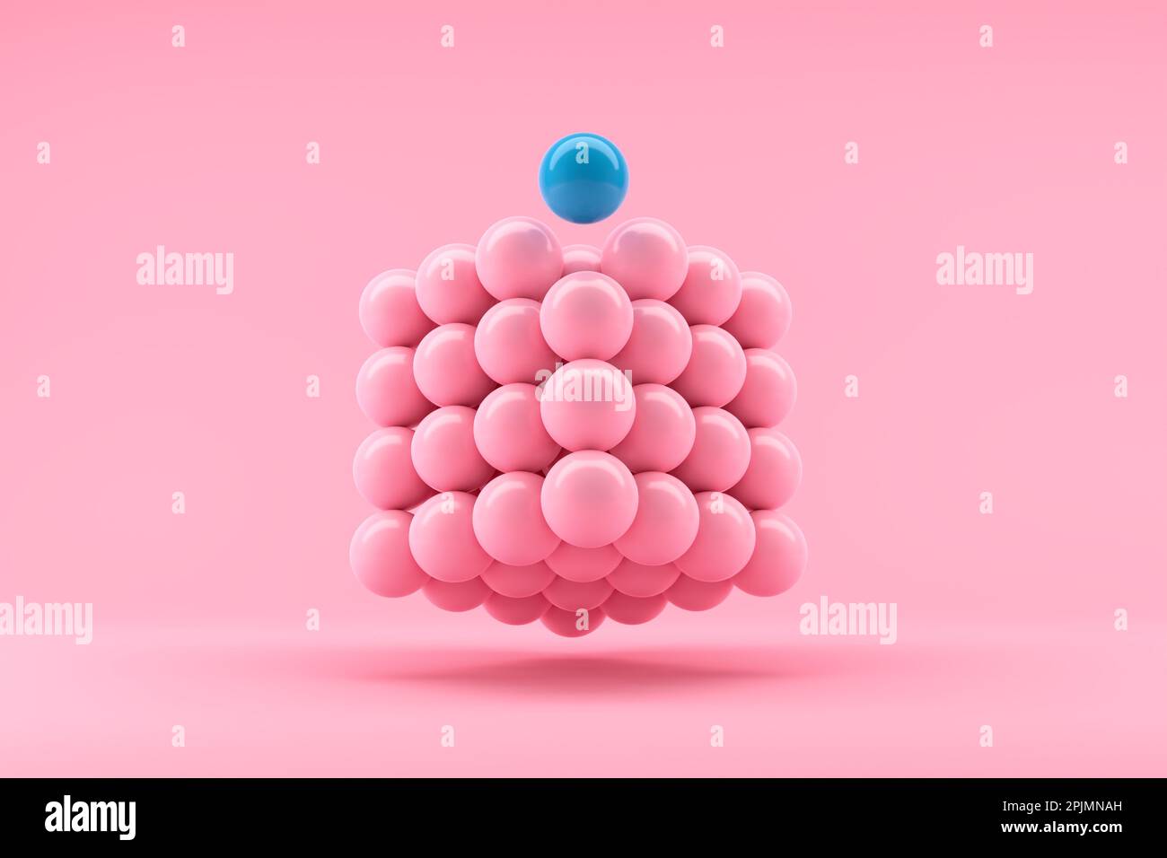 Teamwork, leadership, difference, individuality. Team organization and leading a team. Completing the whole. Blue ball stands out from the pink sphere Stock Photo