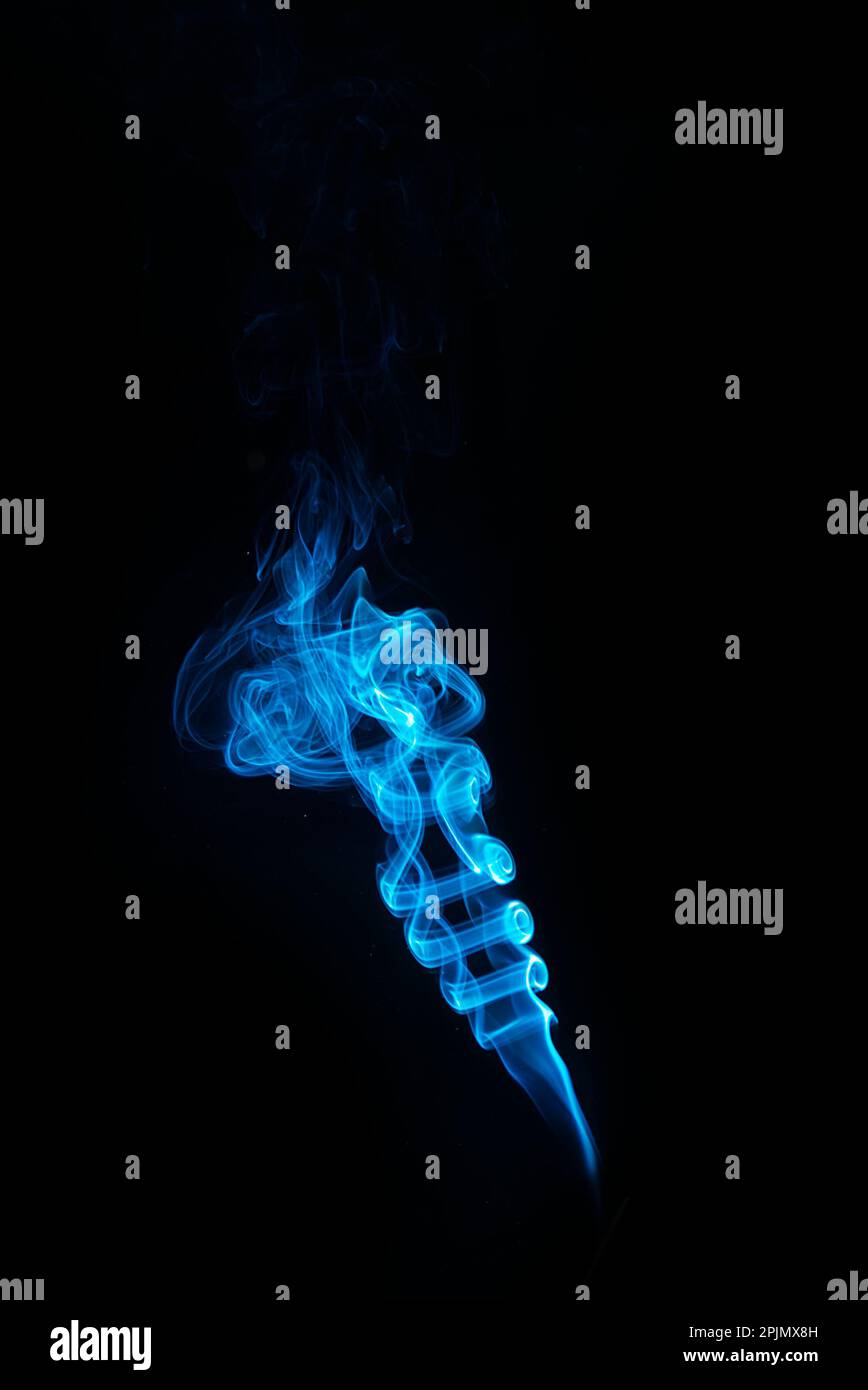swirl of blue smoke isolated on black background Stock Photo - Alamy