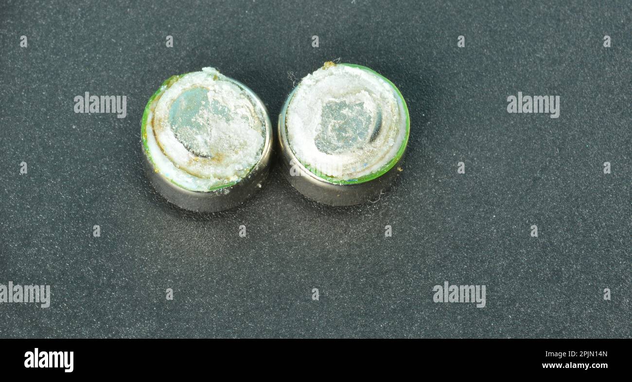 Two oxidized batteries on black background Stock Photo Alamy