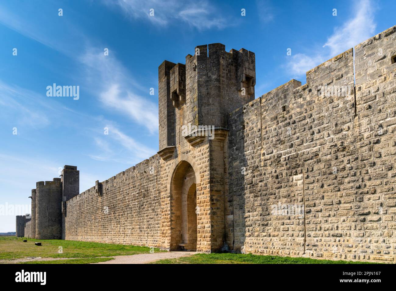 A view of the historic city walls surrounding the Camargue village of Aigues-Mortes Stock Photo