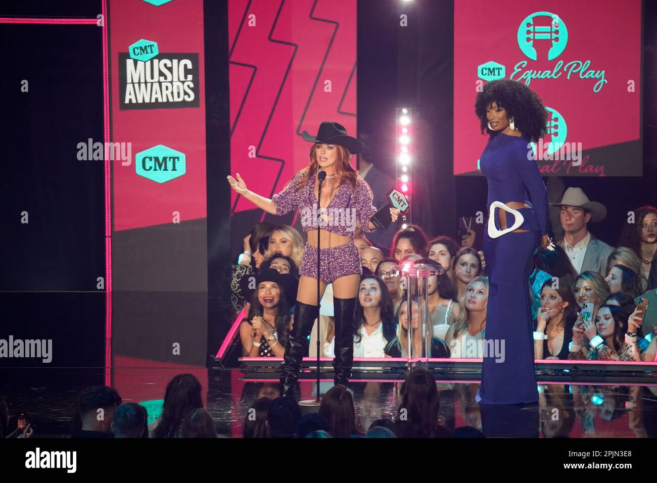 Country singer SHANIA TWAIN (l) accepts her award from presenter and rapper MEGAN THEE STALLION (r) onstage at the 2023 Country Music Awards (CMT) held for the first time in Austin, Texas on April 2, 2023 at the Moody Center before a sold out crowd. Credit: Bob Daemmrich/Alamy Live News Stock Photo