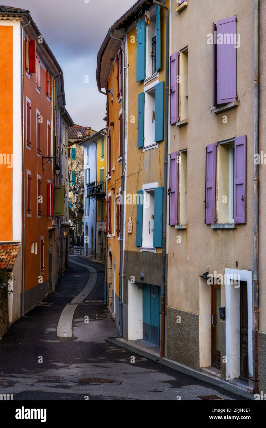 Castellane, France - 8 March, 2023: narrow village street in the center of Castellane with colourful houses Stock Photo