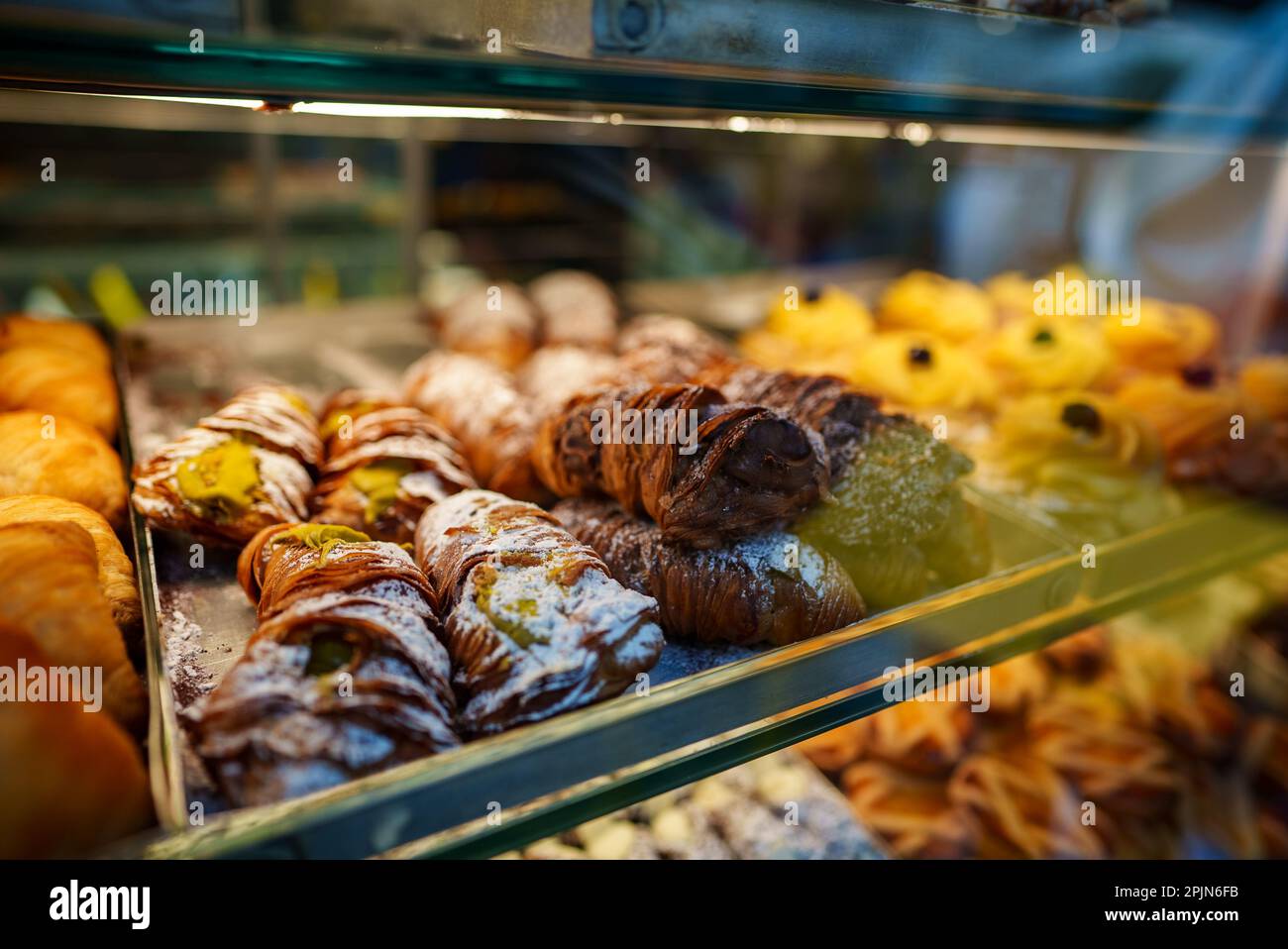 Fresh pastries on display in the store. Stock Photo