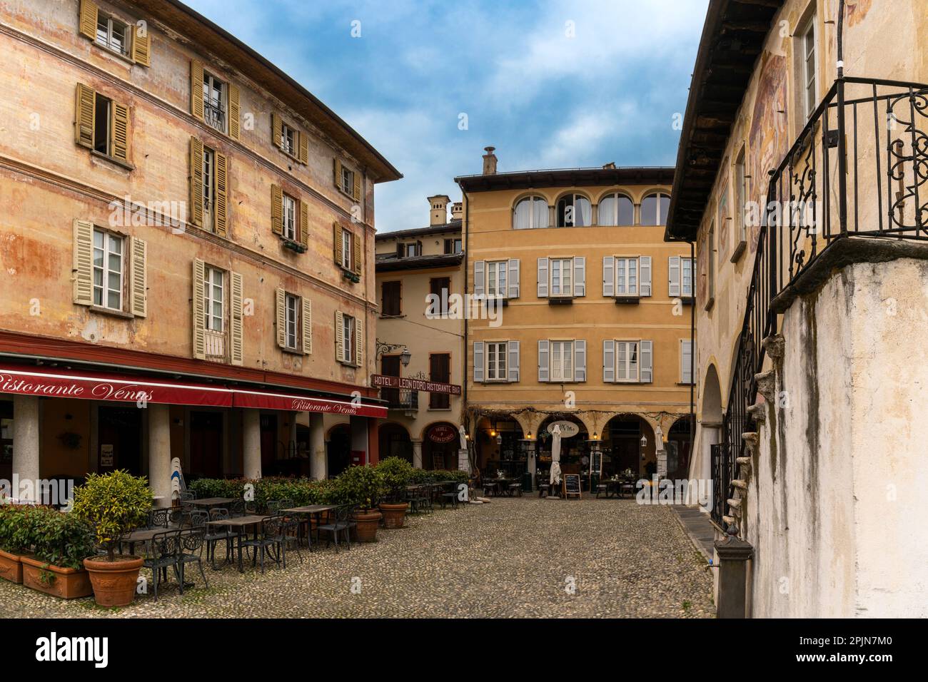 Orta San Giulio, Italy - 13 March, 2023: colorful buildings in the old town center of Orta San Giulio Stock Photo