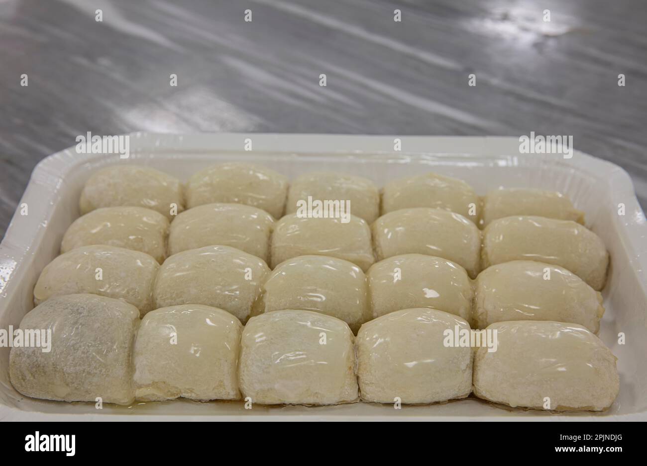A piece of Bosnian style burek. It is a pastry filled with seasoned ...