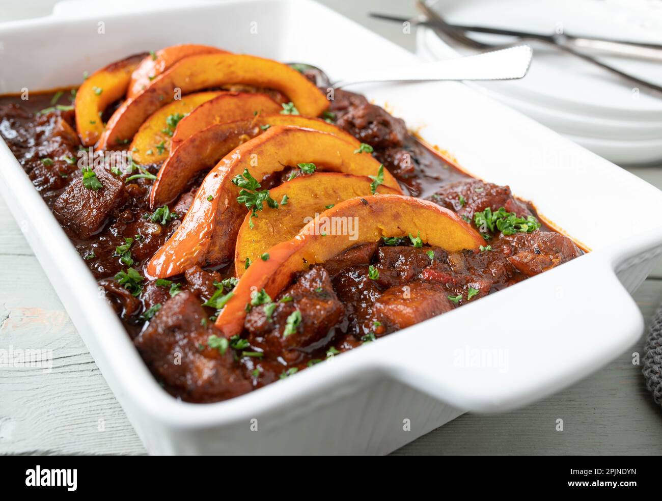 Poultry goulash cooked with low fat chicken breast. Served with roasted pumpkin topping Stock Photo