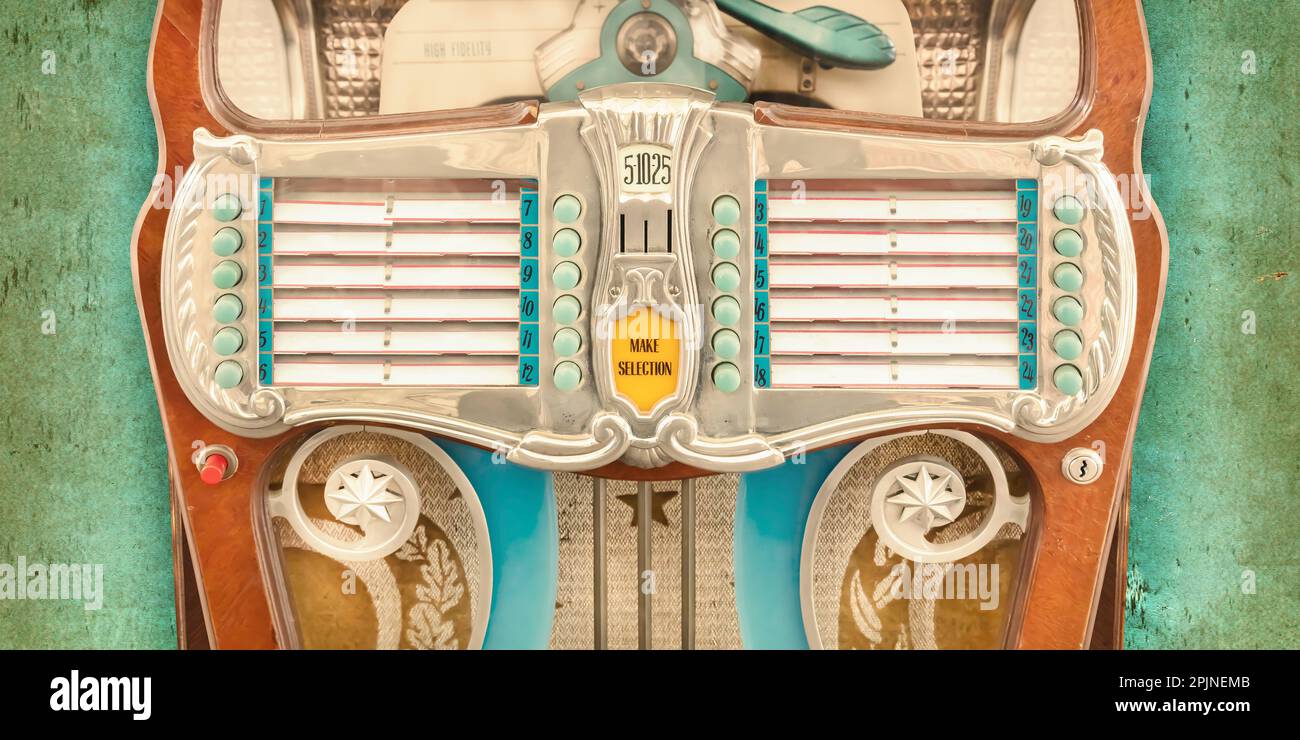 Vintage colorful jukebox in front of a weathered background Stock Photo