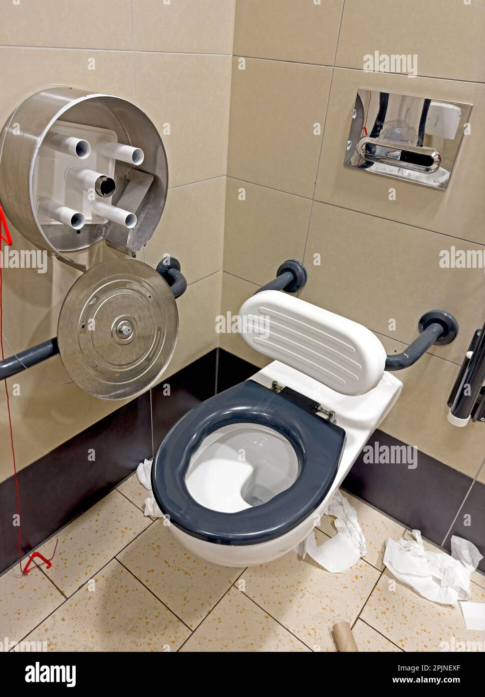Disabled lavatory in a mess, not checked, or cleaned on a regular basis, UK Stock Photo