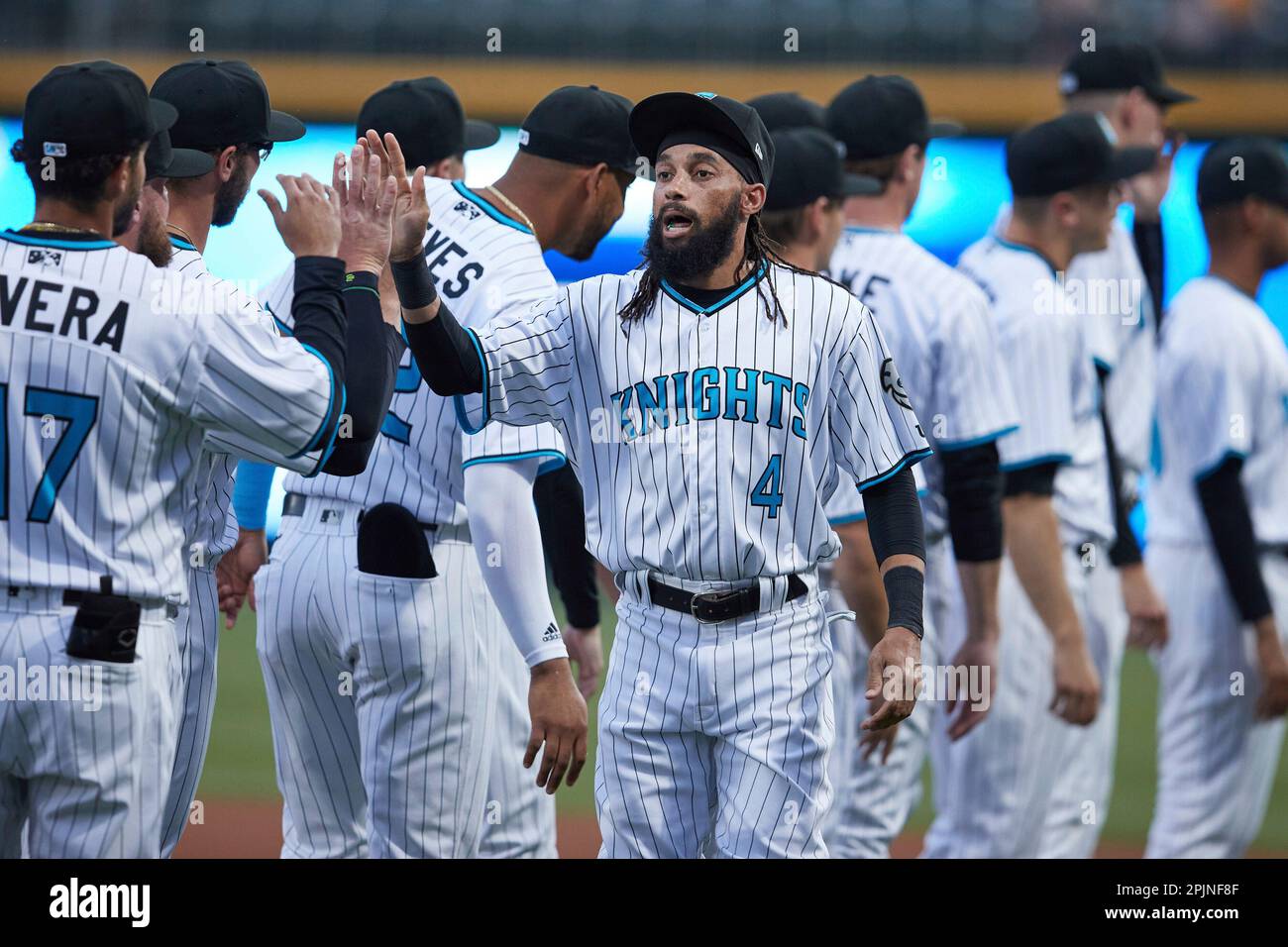 Billy Hamilton (4) of the Charlotte Knights high fives his