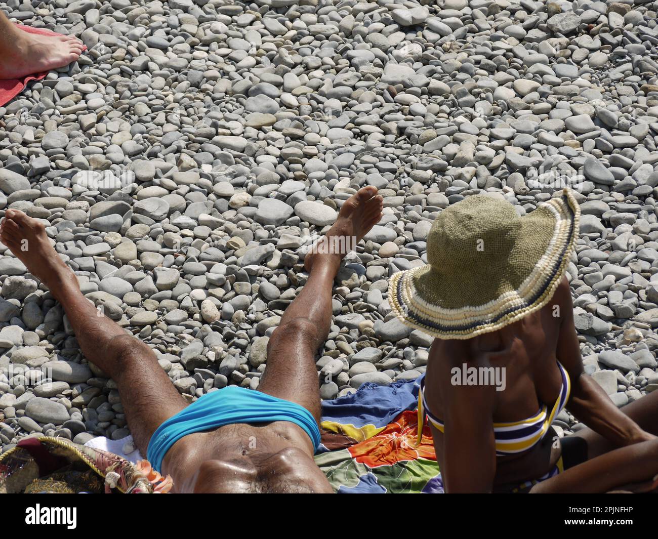 people sunbathing on the beach Stock Photo
