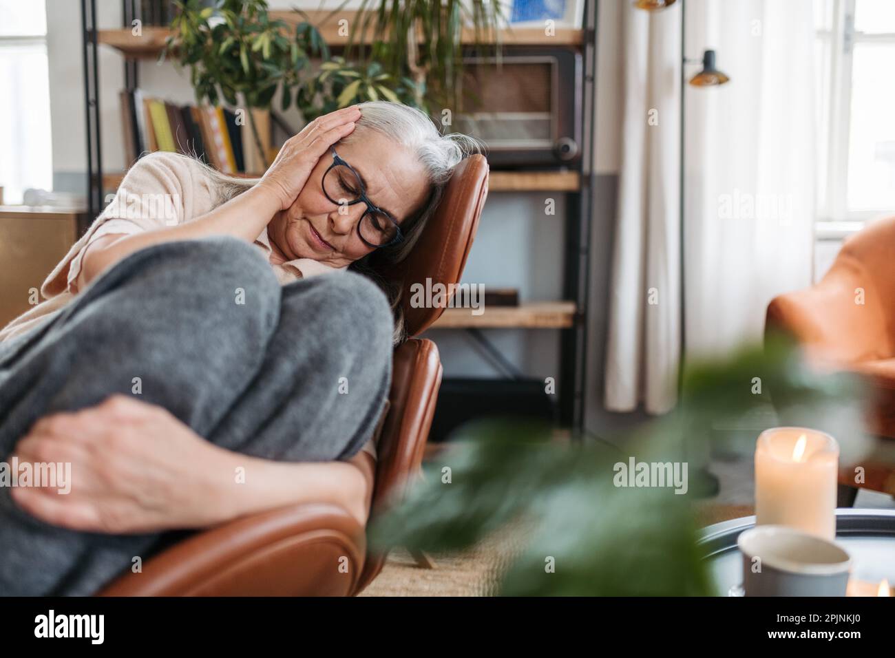 Sad elderly lady sitting in hi-res stock photography and images - Alamy