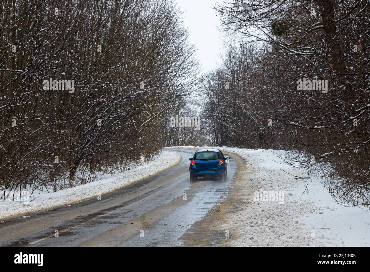 driving in winter after a snowfall, ice on the road, temperatures below zero. Stock Photo