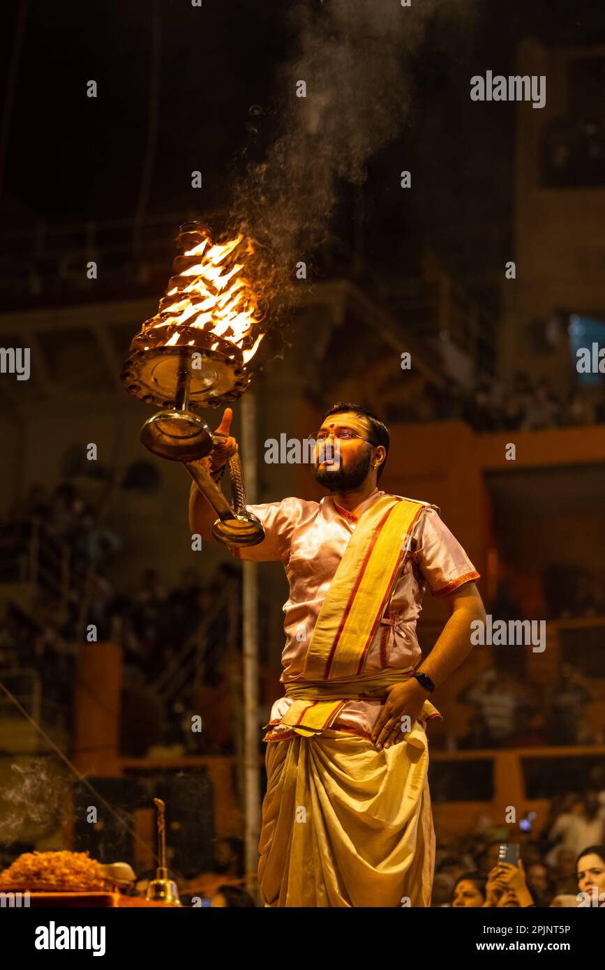 Ganga aarti, Portrait of an young priest performing river ganges ...