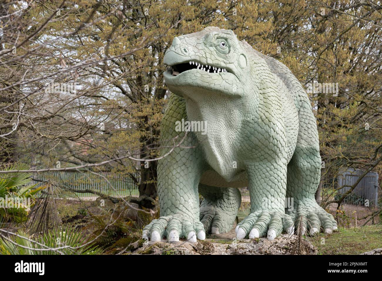 A park landscape of victorian era grade i listed dinosaur sculptures in
