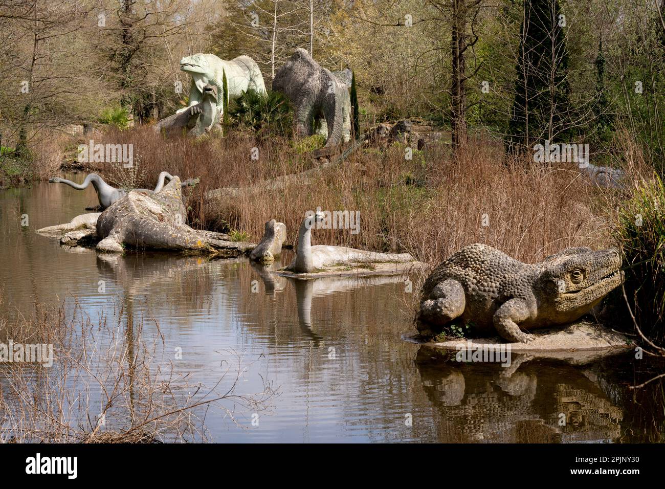 A park landscape of victorian era grade i listed dinosaur sculptures in