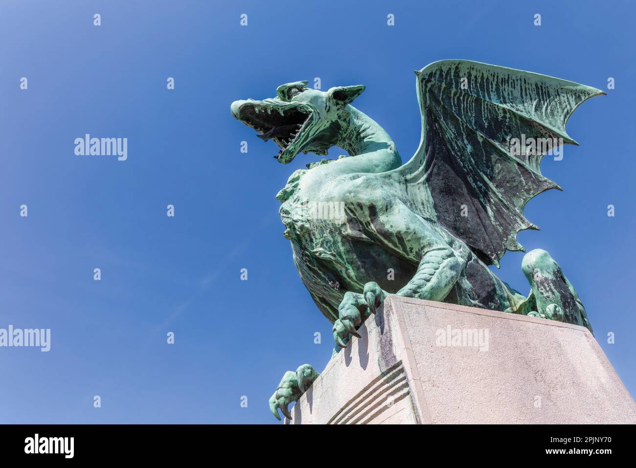 Ljubljana, Slovenia.  Bronze Dragon on the Art Nouveau Dragon Bridge.  The Ljubljana Dragon is the city symbol.  The bridge was designed by architect Stock Photo