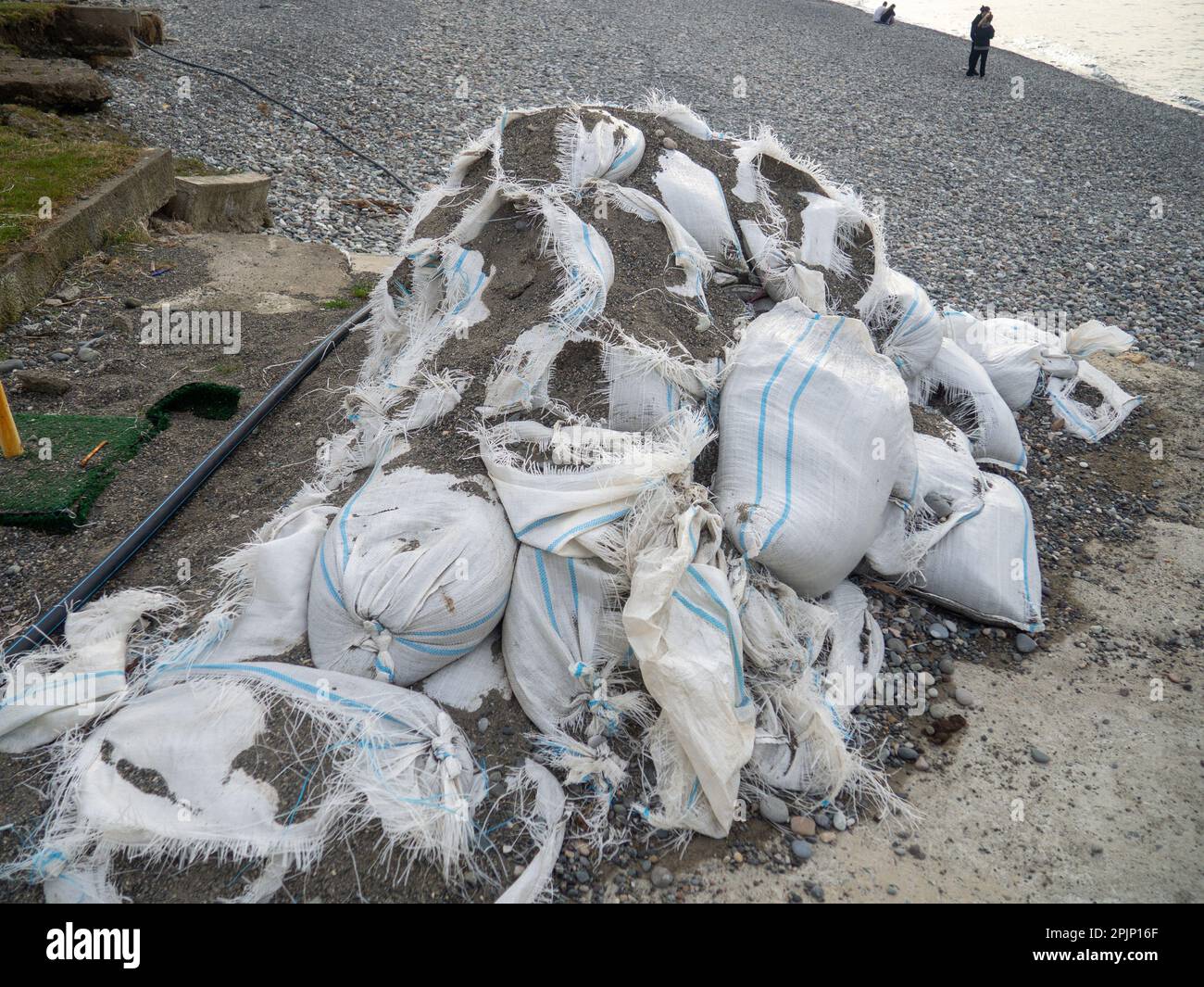 Old bags of cement. White bags with building material. Stopped repair