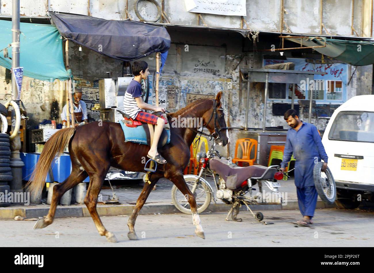 Karachi, Pakistan, April 3, 2023. Children are enjoying horse riding at