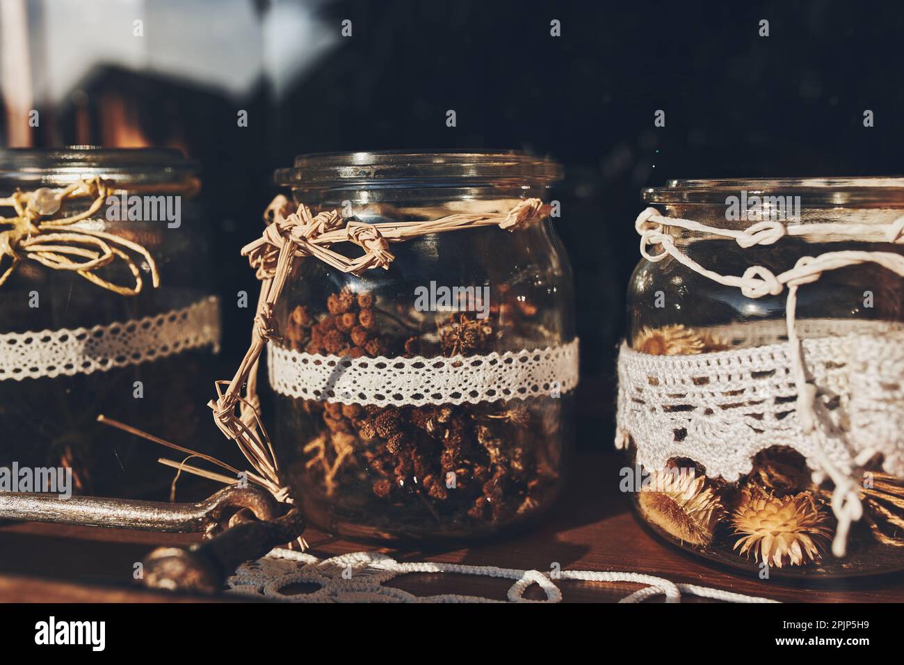 Assorted dried herbs in jars for making herbal tea. Alternative medicine Stock Photo
