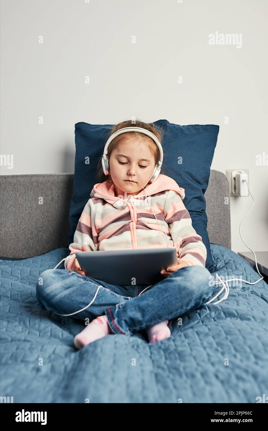 Little girl preschooler learning online solving puzzles playing educational  games on laptop at home - a Royalty Free Stock Photo from Photocase