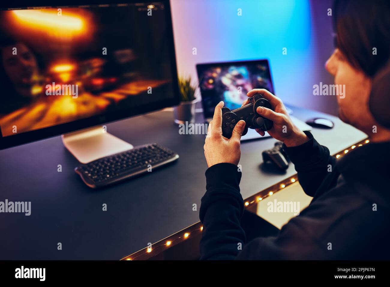 Premium Photo  Gamer playing online game on pc in dark room.