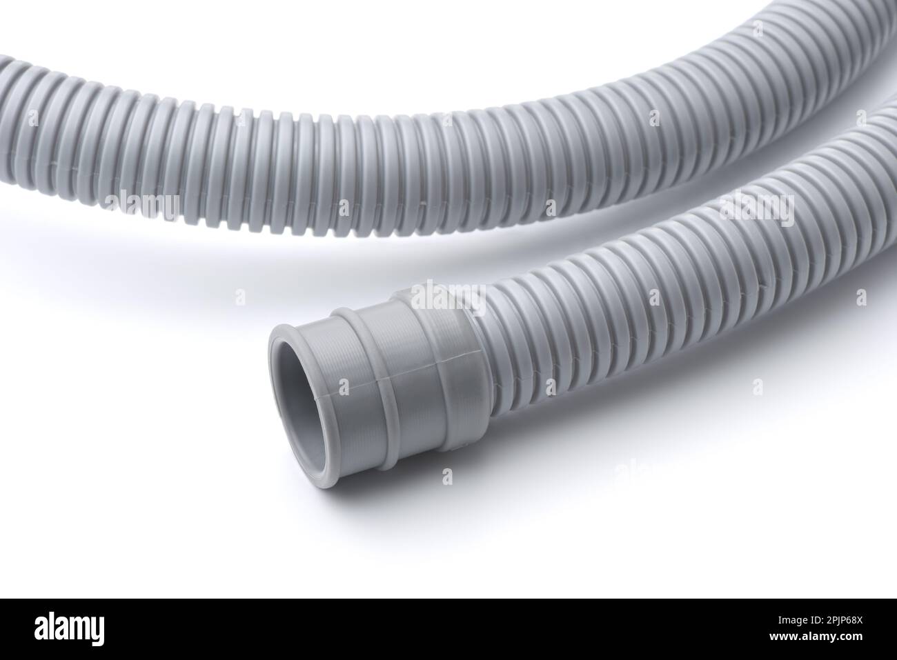 Closeup of gray plastic corrugated hose on white background Stock Photo