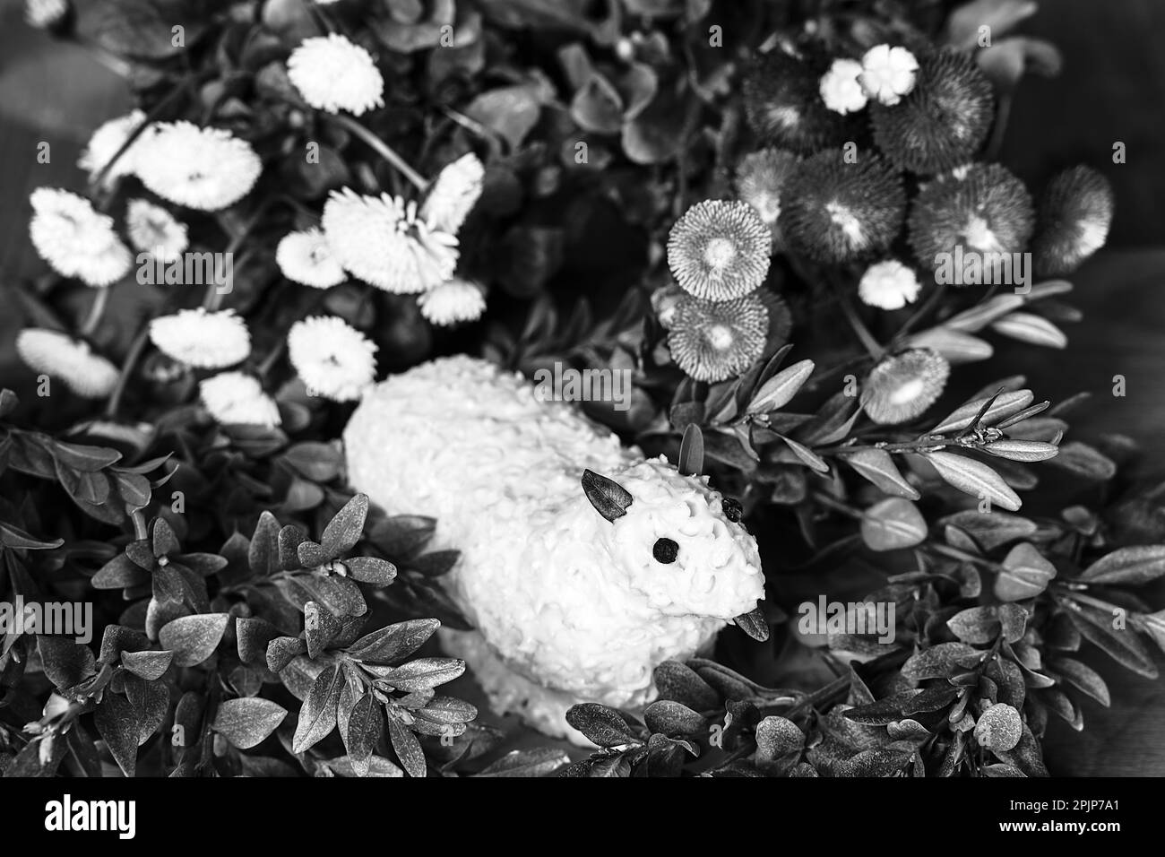 Traditional Easter lamb made of butter, boxwood twigs and colorful