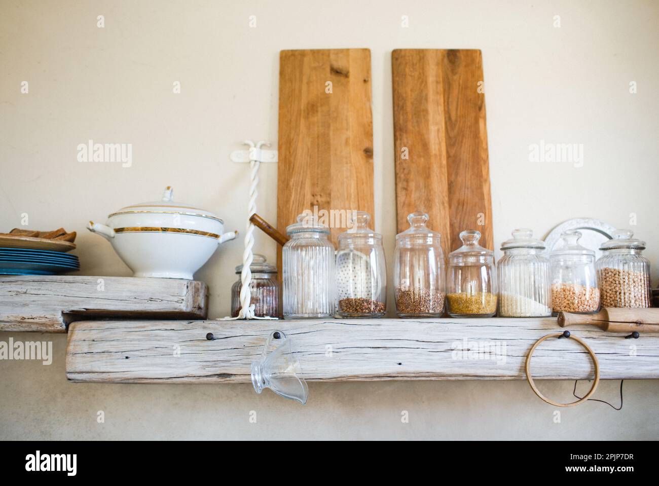 glass jars for storing food in the kitchen. order on the shelves and