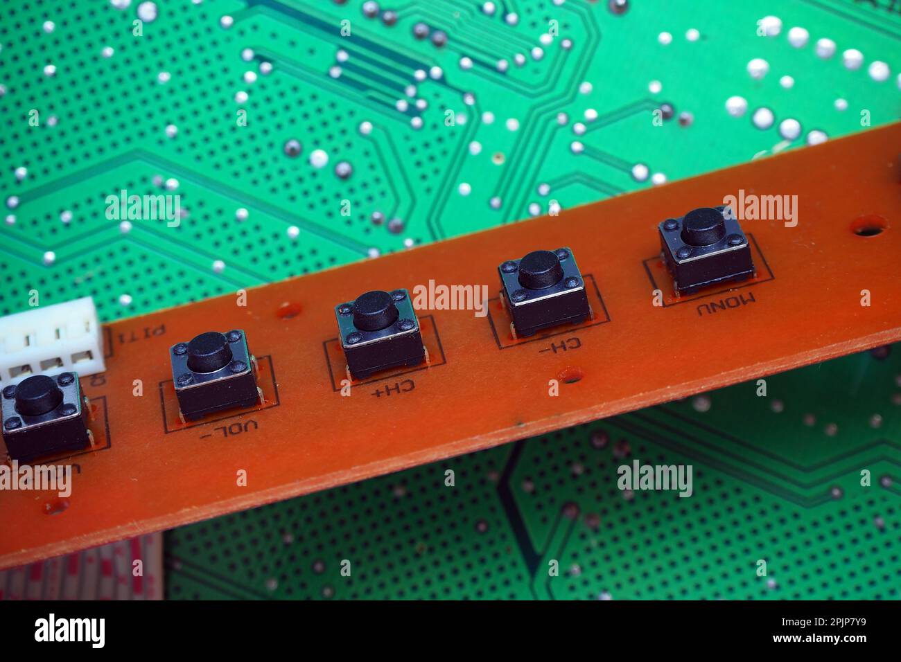 Tactile switches in a row. Tact buttons on an electronic circuit board. Stock Photo