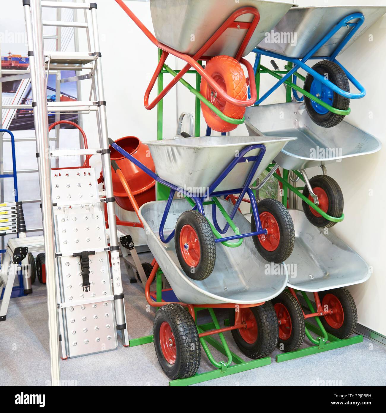 Garden wheelbarrows and ladders in hardware store Stock Photo Alamy