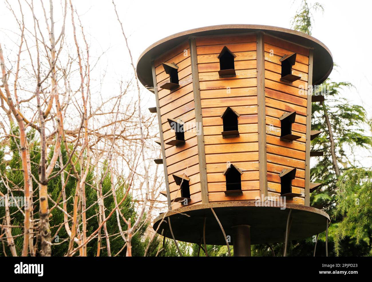 Traditional wooden dovecote. Freestanding dovecot. Weathered wood house for doves and pigeons