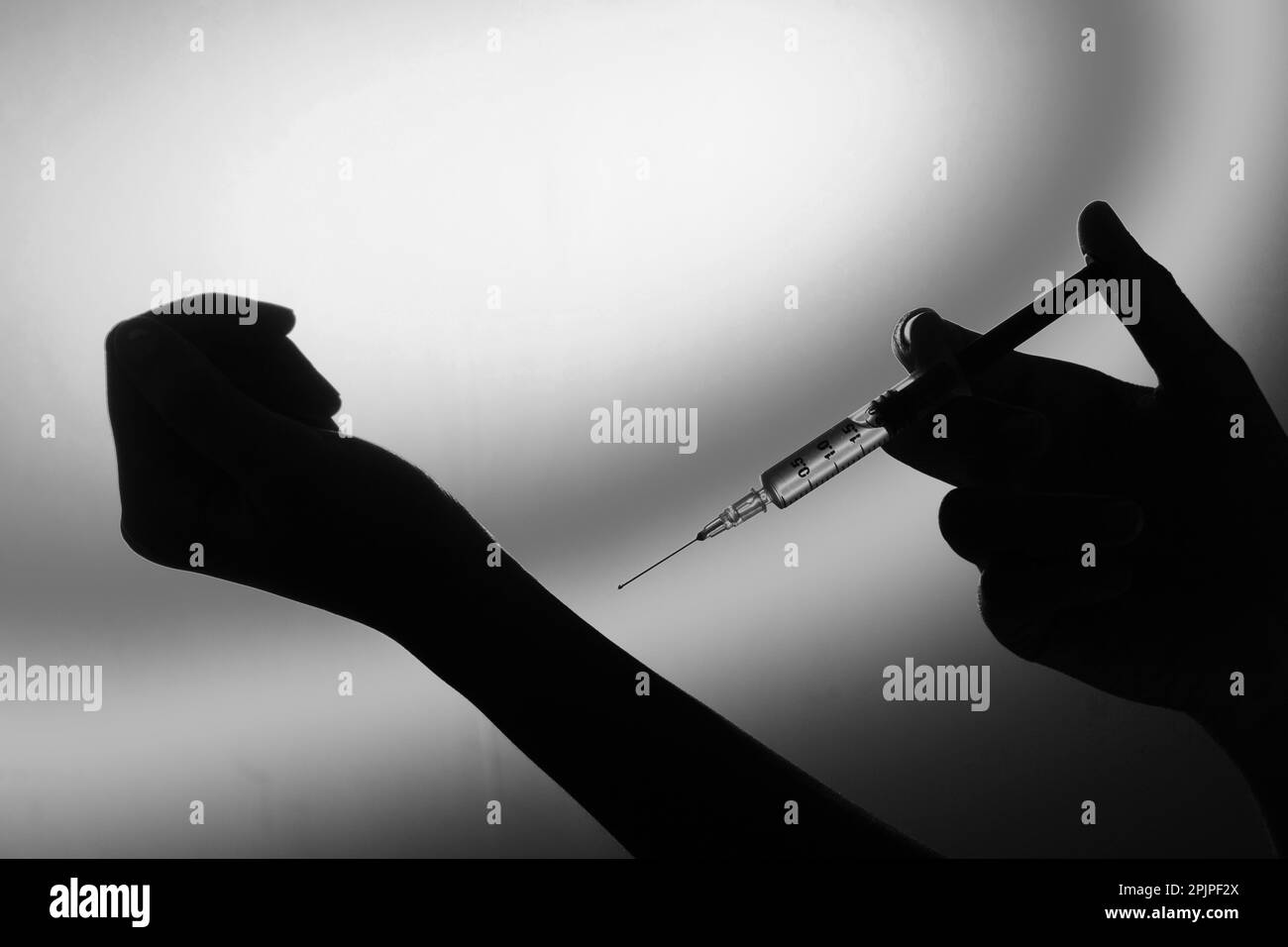 Self injecting drugs in hand Stock Photo - Alamy