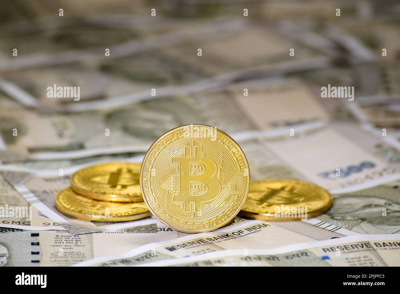 Closeup of bitcoin with indian rupee currency Stock Photo - Alamy