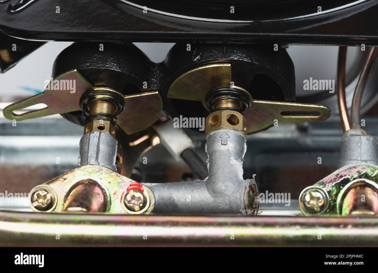 Metal gas connection pipes close up view. Tubes in cooking oven Stock