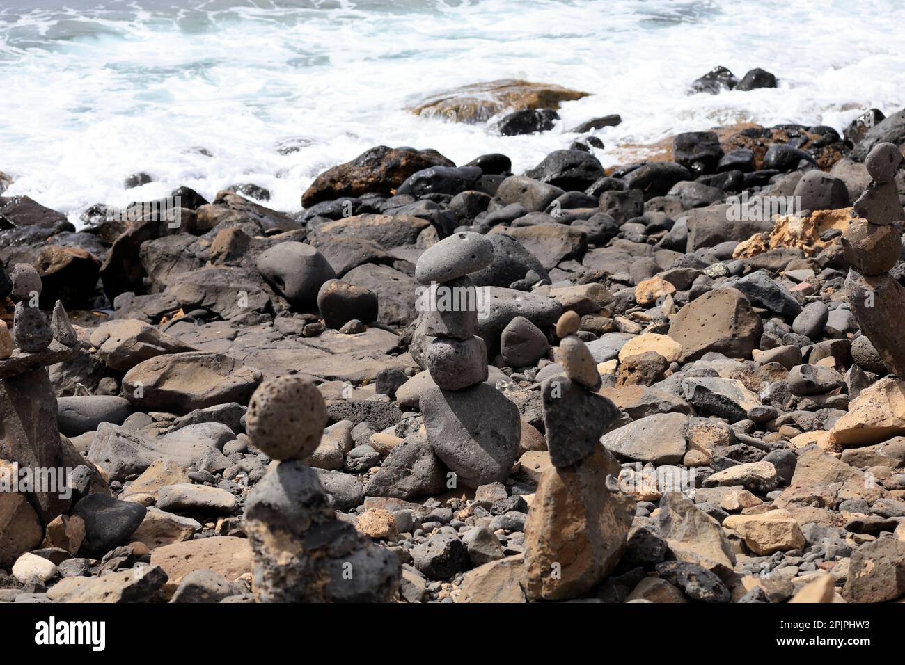 Stacked stones on a beach. Lanzarote. February 2023 Stock Photo Alamy