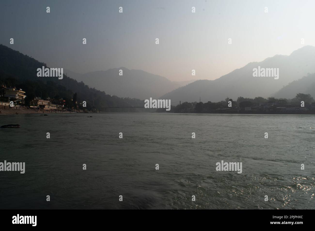 Winter view of holy river ganga and mountains in india Stock Photo