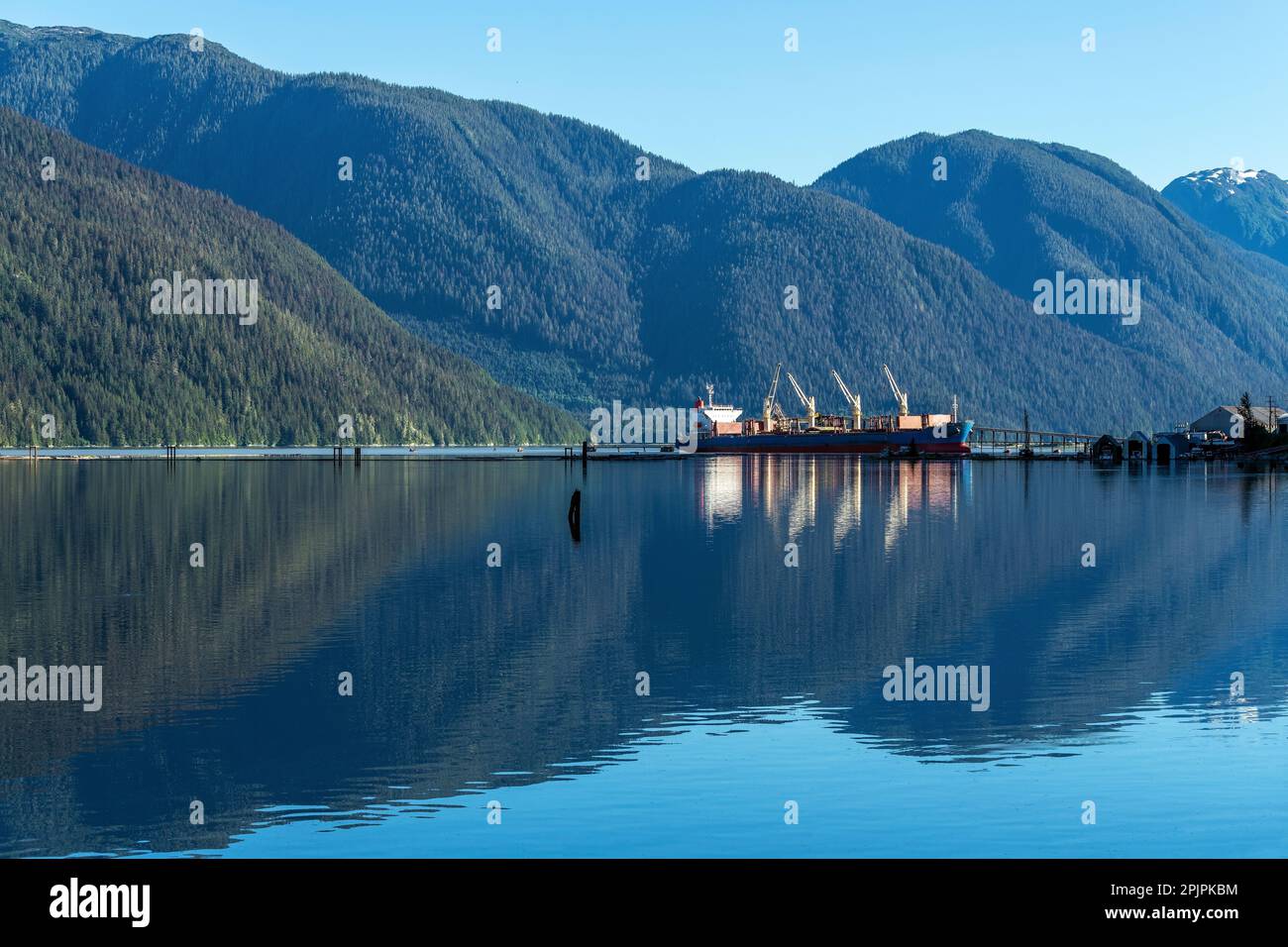 Tanker ship for industrial transport in the harbor of Stewart, British Columbia, Canada. Stock Photo